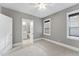 Neutral bedroom features a ceiling fan and open door to an en suite bathroom at 1005 Collins Dr, Raleigh, NC 27609