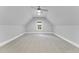 Bonus room with neutral walls, carpet, and a window at 1005 Collins Dr, Raleigh, NC 27609