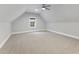 Bonus room with neutral walls, carpet, and a window at 1005 Collins Dr, Raleigh, NC 27609