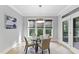 Cozy breakfast nook with stylish lighting fixture and windows with natural light at 1005 Collins Dr, Raleigh, NC 27609
