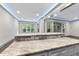 Open concept kitchen with gray cabinets, stone backsplash and granite countertops, perfect for entertaining at 1005 Collins Dr, Raleigh, NC 27609