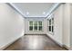 Bright, open room features large windows that provide natural light with gray trim at 1005 Collins Dr, Raleigh, NC 27609