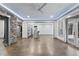 Spacious living area featuring stone accents, a wet bar, and seamless indoor-outdoor flow at 1005 Collins Dr, Raleigh, NC 27609