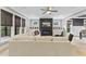 Bright living room with fireplace, built-in cabinets, large windows and a comfortable sofa at 1005 Collins Dr, Raleigh, NC 27609