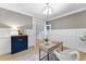 Charming home office with wainscotting, natural light, and hardwood floors, perfect for remote work at 1005 Collins Dr, Raleigh, NC 27609