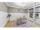 Bright home office featuring custom wainscotting, and a stylish desk, creating a functional workspace at 1005 Collins Dr, Raleigh, NC 27609