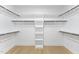 Spacious walk-in closet with custom shelving and ample hanging space for organization at 1005 Collins Dr, Raleigh, NC 27609