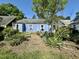 Outdoor patio with mature trees and greenery, offers a private outdoor living space at 1012 Virgie St, Durham, NC 27705