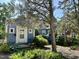 A charming blue bungalow features a well-maintained front yard and an inviting porch at 1012 Virgie St, Durham, NC 27705