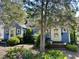 Charming blue house featuring a landscaped front yard and inviting front porch at 1012 Virgie St, Durham, NC 27705