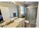 Modern bathroom featuring a glass door shower with marble surround, and ample vanity space at 1021 Forest Glen Dr, Raleigh, NC 27603