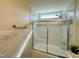 Updated bathroom featuring a bathtub and shower combination with glass door at 1021 Forest Glen Dr, Raleigh, NC 27603