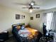 Bedroom featuring a baseball themed bed spread and decor with a ceiling fan at 1021 Forest Glen Dr, Raleigh, NC 27603