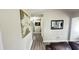 Hallway with art and a mirror at 1021 Forest Glen Dr, Raleigh, NC 27603