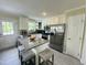 Bright kitchen with stainless steel appliances, a center island, and ample counter space at 1021 Forest Glen Dr, Raleigh, NC 27603