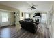 Bright living room with a vaulted ceiling, fireplace, and doorway to the hall at 1021 Forest Glen Dr, Raleigh, NC 27603