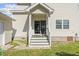 This home features a sliding glass back door with stairs and an adjacent garden at 104 N Green St, Selma, NC 27576