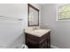 Bathroom featuring vanity with sink, mirror, and natural light at 104 N Green St, Selma, NC 27576
