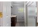 Cozy bathroom featuring a vanity and walk-in shower, providing essential amenities at 104 N Green St, Selma, NC 27576