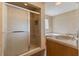 This bathroom has a shower, jacuzzi tub, a tiled floor, and a marble countertop at 104 N Green St, Selma, NC 27576