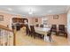 Open-concept dining room and kitchen area with tile floors and natural light at 104 N Green St, Selma, NC 27576
