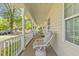 Inviting front porch offers seating and views with classic railing at 104 N Green St, Selma, NC 27576