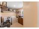 This laundry room features a washer, dryer, built-in shelving and storage cabinets at 104 N Green St, Selma, NC 27576