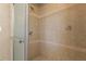 This bathroom has neutral-toned tiling, and a glass-enclosed shower at 104 N Green St, Selma, NC 27576