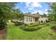 Lush backyard featuring manicured landscaping, a patio area, and a verdant lawn, creating a serene outdoor space at 108 Boone St, Chapel Hill, NC 27516