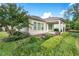Charming backyard featuring a well-manicured lawn, lush landscaping, and a cozy patio with an outdoor seating area at 108 Boone St, Chapel Hill, NC 27516