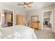 Bedroom featuring neutral wall color, ceiling fan, and doorway to ensuite bathroom at 108 Boone St, Chapel Hill, NC 27516