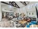 Spacious clubhouse featuring a modern bar area, lounge seating, and ample table space at 108 Boone St, Chapel Hill, NC 27516