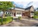 Elegant clubhouse entrance featuring stone accents, red doors, and landscaping for a welcoming feel at 108 Boone St, Chapel Hill, NC 27516