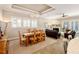Dining area featuring a chandelier, wooden table, and seamless transition to the living room at 108 Boone St, Chapel Hill, NC 27516