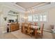 Elegant dining room with a tray ceiling, chandelier, and seamlessly connected living space at 108 Boone St, Chapel Hill, NC 27516