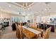 Open-concept home featuring dining area with chandelier, fireplace, and island kitchen with bar seating at 108 Boone St, Chapel Hill, NC 27516