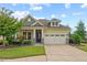 Charming single-Gathering home featuring a well-manicured lawn and a two-car garage, exuding curb appeal at 108 Boone St, Chapel Hill, NC 27516