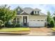 Charming two-story home with a manicured lawn and two car garage, showing great curb appeal at 108 Boone St, Chapel Hill, NC 27516