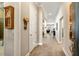 Hallway featuring neutral tones, tiled floor, detailed trim work and an open concept design at 108 Boone St, Chapel Hill, NC 27516