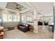Cozy living room showcasing an open-concept floor plan with a tray ceiling and many windows at 108 Boone St, Chapel Hill, NC 27516