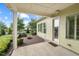 Covered outdoor patio with elegant stonework, landscaping, and peaceful backyard views, perfect for relaxation at 108 Boone St, Chapel Hill, NC 27516
