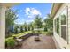 Beautiful backyard patio featuring stone seating and manicured landscaping, ideal for outdoor enjoyment at 108 Boone St, Chapel Hill, NC 27516