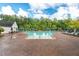 Community swimming pool surrounded by lounge chairs and cabanas, perfect for summer relaxation and recreation at 108 Boone St, Chapel Hill, NC 27516