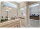 Bright bathroom showcasing an open shower, a glass door, tile accents, and acces to walk in closet at 108 Boone St, Chapel Hill, NC 27516
