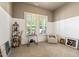 Sitting room with a two tone accent wall, shuttered windows, an accent chair, and carpeted floors at 108 Boone St, Chapel Hill, NC 27516