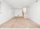 Spacious finished basement with carpet, paneled walls, and staircase to upper level at 1103 Brucemont Dr, Garner, NC 27529