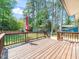 Spacious wooden deck is perfect for outdoor entertaining and relaxation in a beautiful, wooded backyard at 1103 Brucemont Dr, Garner, NC 27529