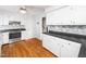 Updated kitchen with white cabinets and modern countertops at 1103 Brucemont Dr, Garner, NC 27529