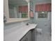 Bright bathroom features gray cabinetry, and neutral-colored walls creating a clean and stylish space at 114 Short E St, Hillsborough, NC 27278