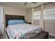 Comfortable bedroom with stylish headboard, soft lighting, and a plush bedspread, creating a relaxing atmosphere at 114 Short E St, Hillsborough, NC 27278